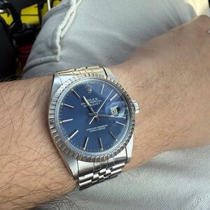 Rolex Silver and Blue Watch with Fluted Bezel and Stainless Steel Band